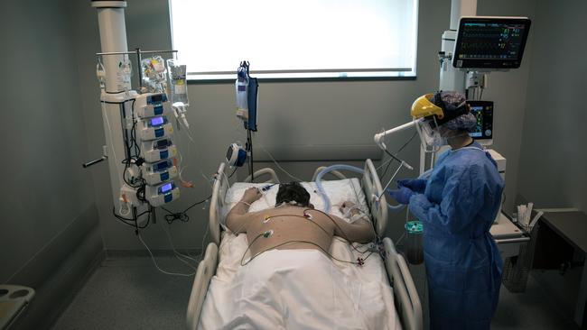 A nurse tends to a patient infected with the COVID-19 virus at the Acibadem Altunizade Hospital in Istanbul, Turkey.
