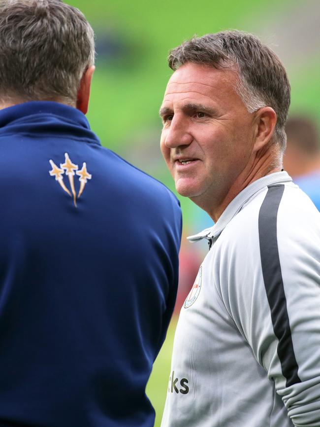 Warren Joyce chats with Newcastle Jets coach Ernie Merrick. Pic: AAP