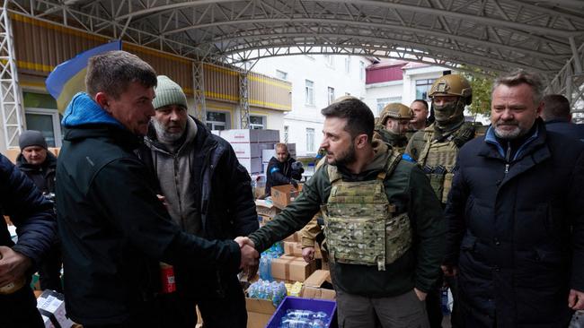 Volodymyr Zelenskyy meets locals while visiting the town of Bucha. Picture: AFP