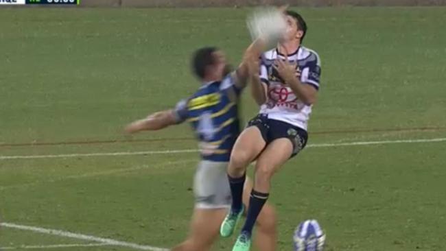 Hayne chases a bomb and jumps to put off North Queensland's Lachlan Coote. Picture: Fox League