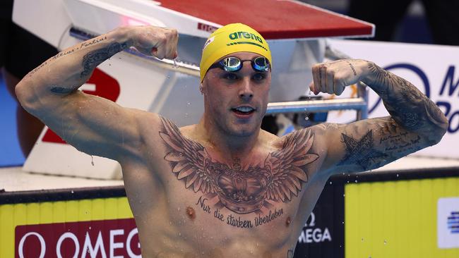 King Kyle celebrates after winning gold in the Men's 100m Freestyle Final at the World Aquatics Championships in Japan. (Photo by Clive Rose/Getty Images)