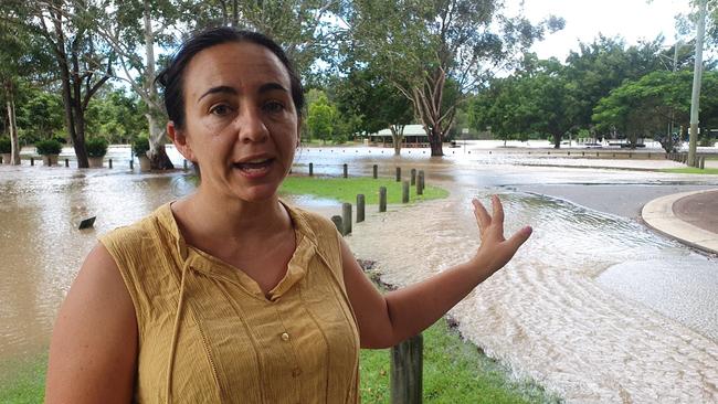 Angela Konstantinos, 39, of Tanah Merah at Alexander Clark Park, Loganholme. She says she has never seen the water that high, nor has she ever seen fast flowing water over the road from floods before. Picture: Supplied