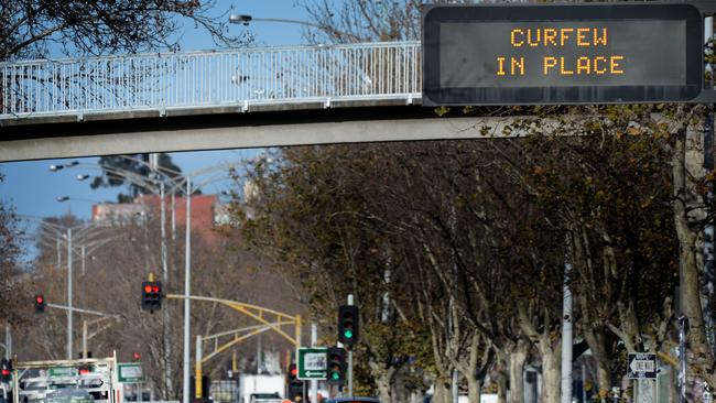 A curfew sign on Hoodle Street in Collingwood. Picture: NCA NewsWire / Andrew Henshaw