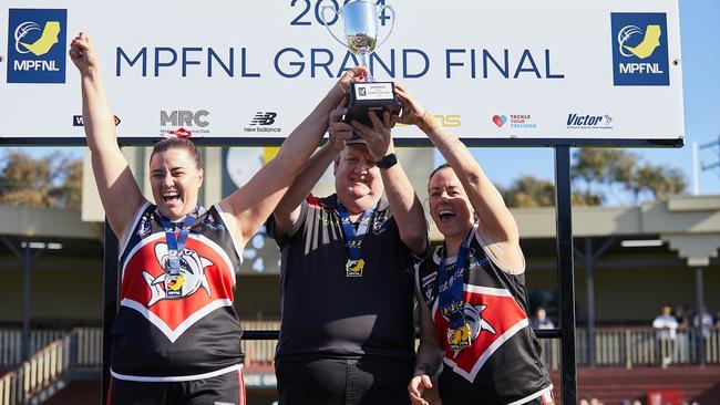 Bonbeach lift the premiership trophy after winning the MPFNL Women’s Division Two grand final at Frankston Park on Saturday. Picture: Carly Ravenhall