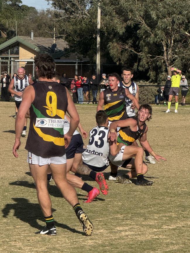 Dromana players scrap for the ball. Picture: Simon McEvoy