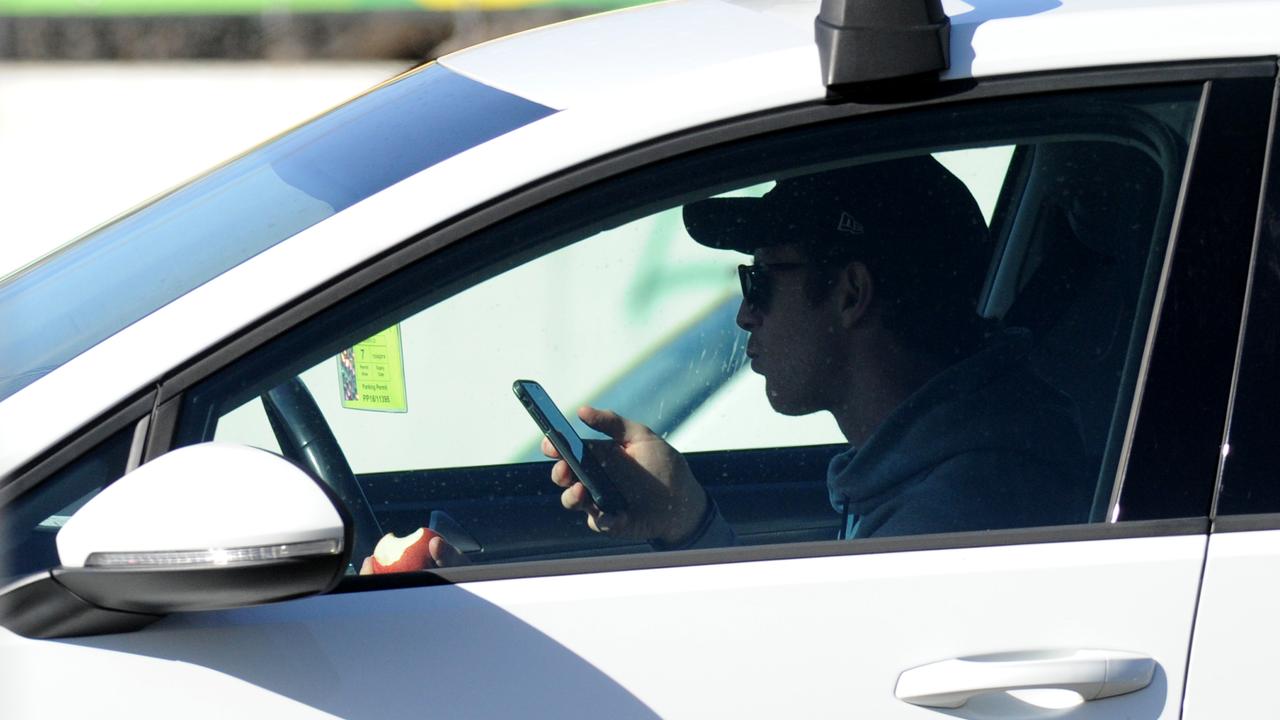 People on Mobile Phones While Driving