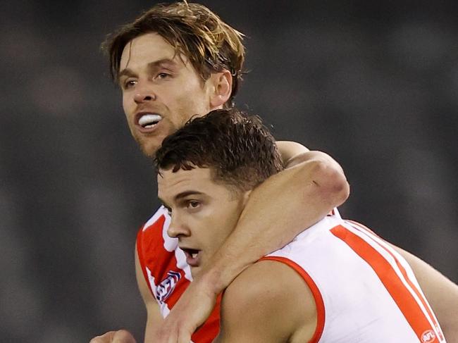 MELBOURNE, AUSTRALIA - AUGUST 14: Dane Rampe (L) and Tom Papley of the Swans celebrate during the 2021 AFL Round 22 match between the North Melbourne Kangaroos and the Sydney Swans at Marvel Stadium on August 14, 2021 in Melbourne, Australia. (Photo by Michael Willson/AFL Photos via Getty Images)