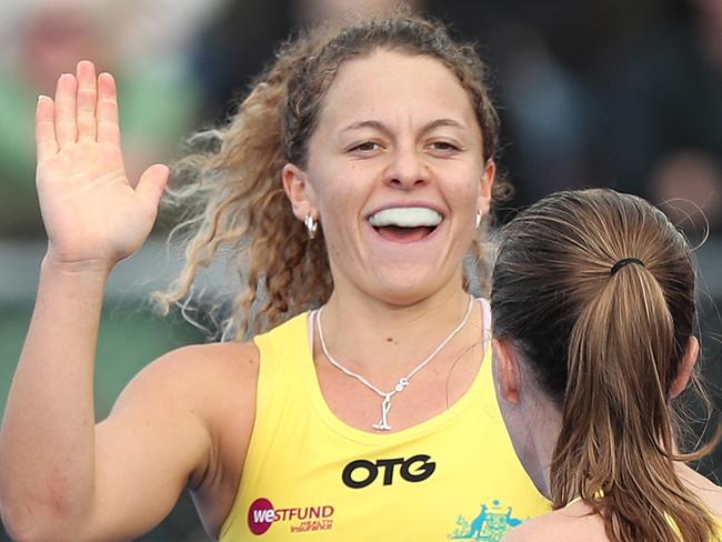 PALMERSTON NORTH, NEW ZEALAND - MAY 30: Rosie Malone (L) is congratulated on scoring a goal by Emily Chalker of Australia during the Trans-Tasman Series Hockey Match between New Zealand and Australia on May 30, 2021 in Palmerston North, New Zealand. (Photo by Dave Rowland/Getty Images)