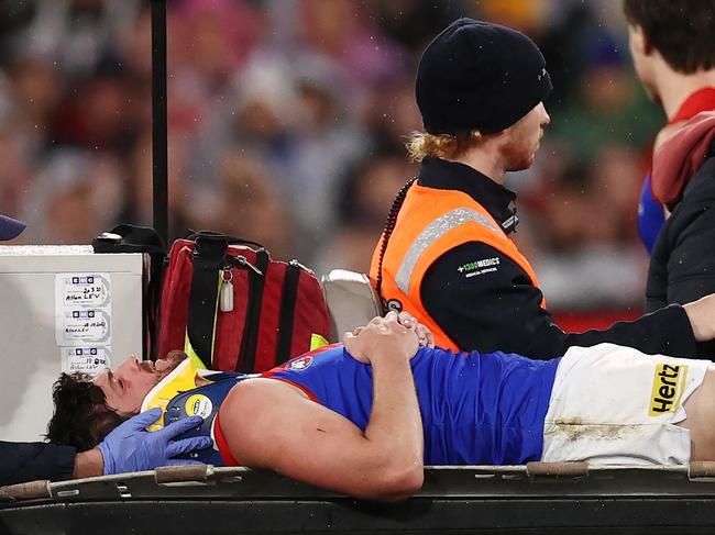 MELBOURNE, AUSTRALIA - August 18, 2023. AFL . 1st Qualifying Final.    Angus Brayshaw of the Demons is stretchered off the ground after being cleaned up by Brayden Maynard of the Magpies   during the qualifying final between Collingwood and Melbourne at the MCG in Melbourne, Australia.  Photo by Michael Klein.
