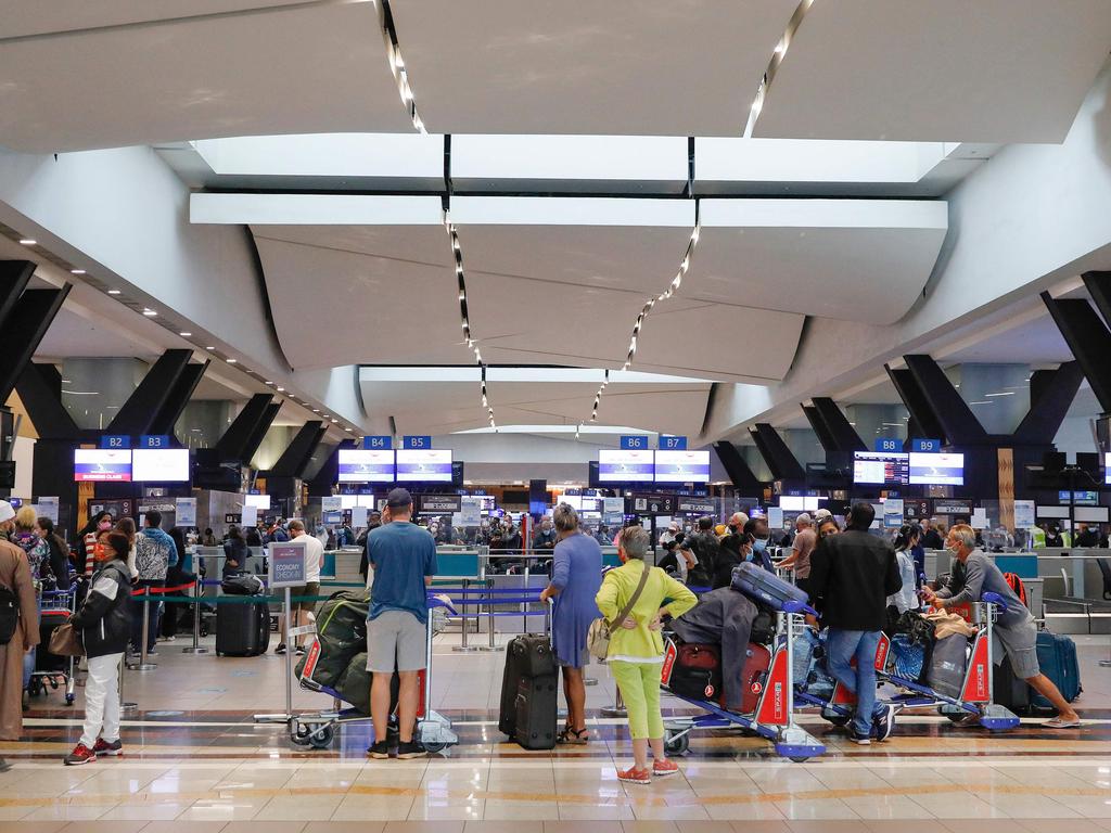 Travellers queue at OR Tambo International Airport in Johannesburg after several countries banned flights from South Africa after the discovery of Omicron. Picture: Phill Magakoe/AFP