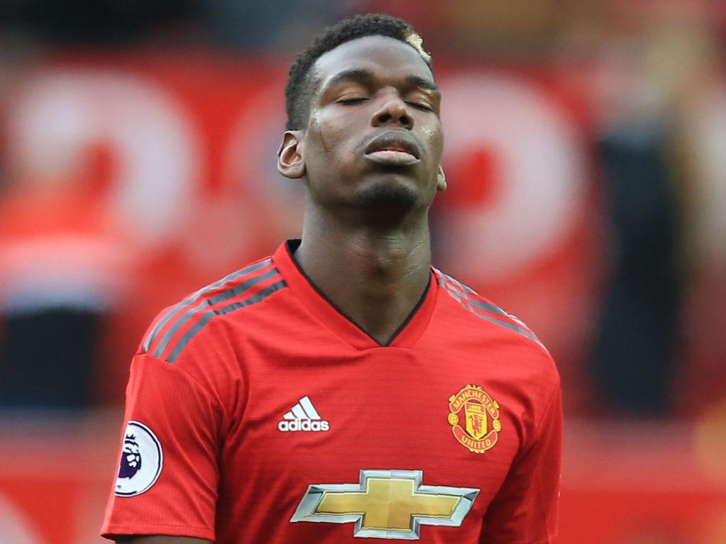 Manchester United's French midfielder Paul Pogba reacts as he leaves the pitch after the English Premier League football match between Manchester United and Wolverhampton Wanderers at Old Trafford in Manchester, north west England, on September 22, 2018. - The game finished 1-1. (Photo by Lindsey PARNABY / AFP) / RESTRICTED TO EDITORIAL USE. No use with unauthorized audio, video, data, fixture lists, club/league logos or 'live' services. Online in-match use limited to 120 images. An additional 40 images may be used in extra time. No video emulation. Social media in-match use limited to 120 images. An additional 40 images may be used in extra time. No use in betting publications, games or single club/league/player publications. /