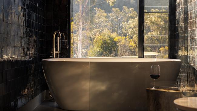 Guests can take in bush views from the bathtub. Picture: Lee Besser