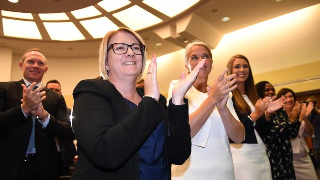 2017: Coralee O'Rourke with fellow members give Premier Annastacia Palaszczuk a standing ovation. (AAP Image/Dan Peled)