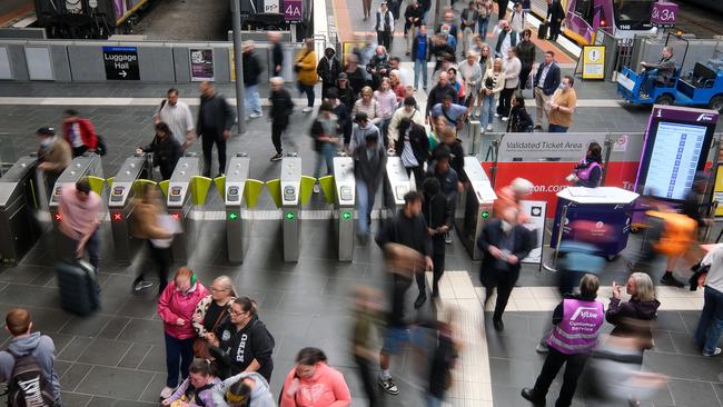 MELBOURNE, AUSTRALIA - NewsWire Photos DECEMBER 13, 2022: Photo commuters at Southern Cross train station.Picture: NCA NewsWire / Luis Enrique Ascui