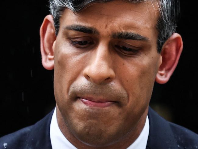 TOPSHOT - Britain's Prime Minister Rishi Sunak delivers a speech to announce July 4 as the date of the UK's next general election, at 10 Downing Street in central London, on May 22, 2024. UK Prime Minister Rishi Sunak on Wednesday set a general election date for July 4, ending months of speculation about when he would go to the country. The vote -- the third since the Brexit referendum in 2016 and the first in July since 1945 -- comes as Sunak seeks to capitalise on better economic data to woo voters hit by cost-of-living rises. (Photo by HENRY NICHOLLS / AFP)