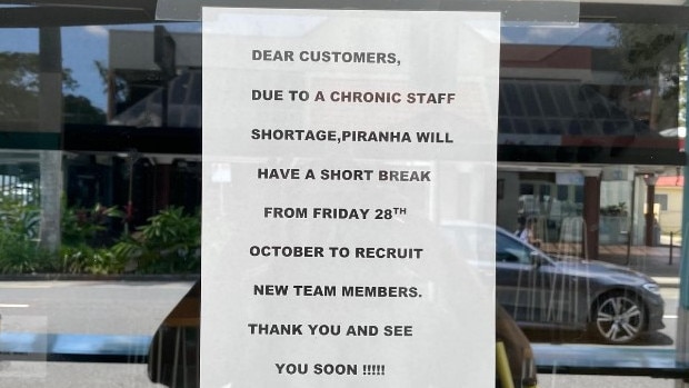 The closed sign on the Piranha Fish Cafe window.