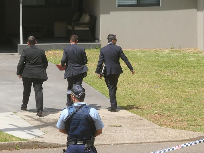 Police outside the Georges Hall home involved in the drive by shooting.