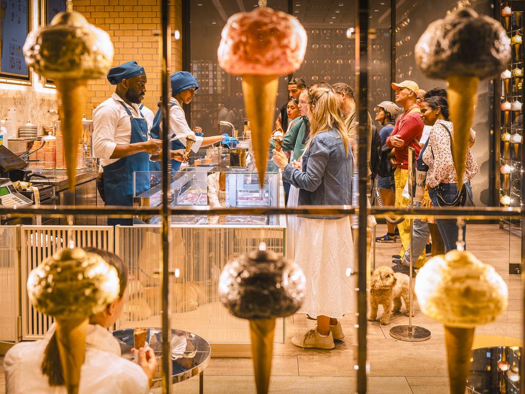 Captured on a warm afternoon at London’s Battersea Power Station, two ice cream shop staff diligently serve a queue of customers seen through the shop’s distinctive window. Picture: Derek Snee/Pink Lady® Food Photographer of the Year