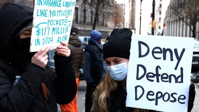 People demonstrating against the healthcare industry stand outside Federal Criminal Court as Luigi Mangione, suspect in the killing of UnitedHealthcare CEO Brian Thompson, appears during an arraignment hearing on December 19, 2024 in New York City. Picture: Getty Images via AFP