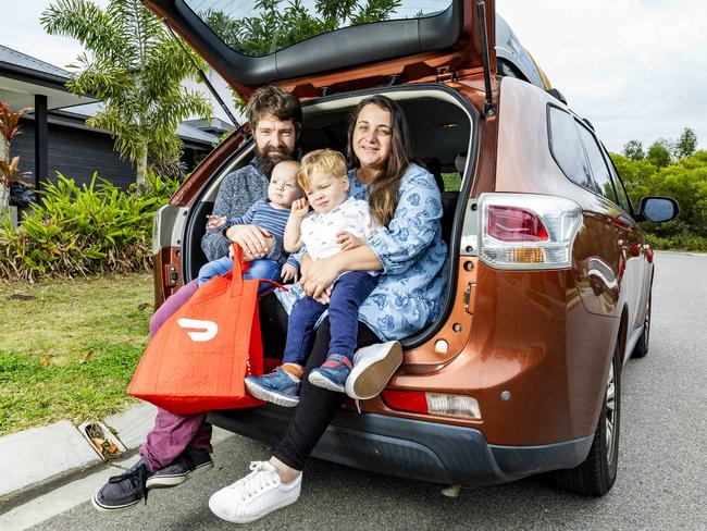 DoorDash deliverers Tristan and Gemma Bates-Smith with 10-month-old Zachariah and two-year-old Ezekiel. Picture: Richard Walker