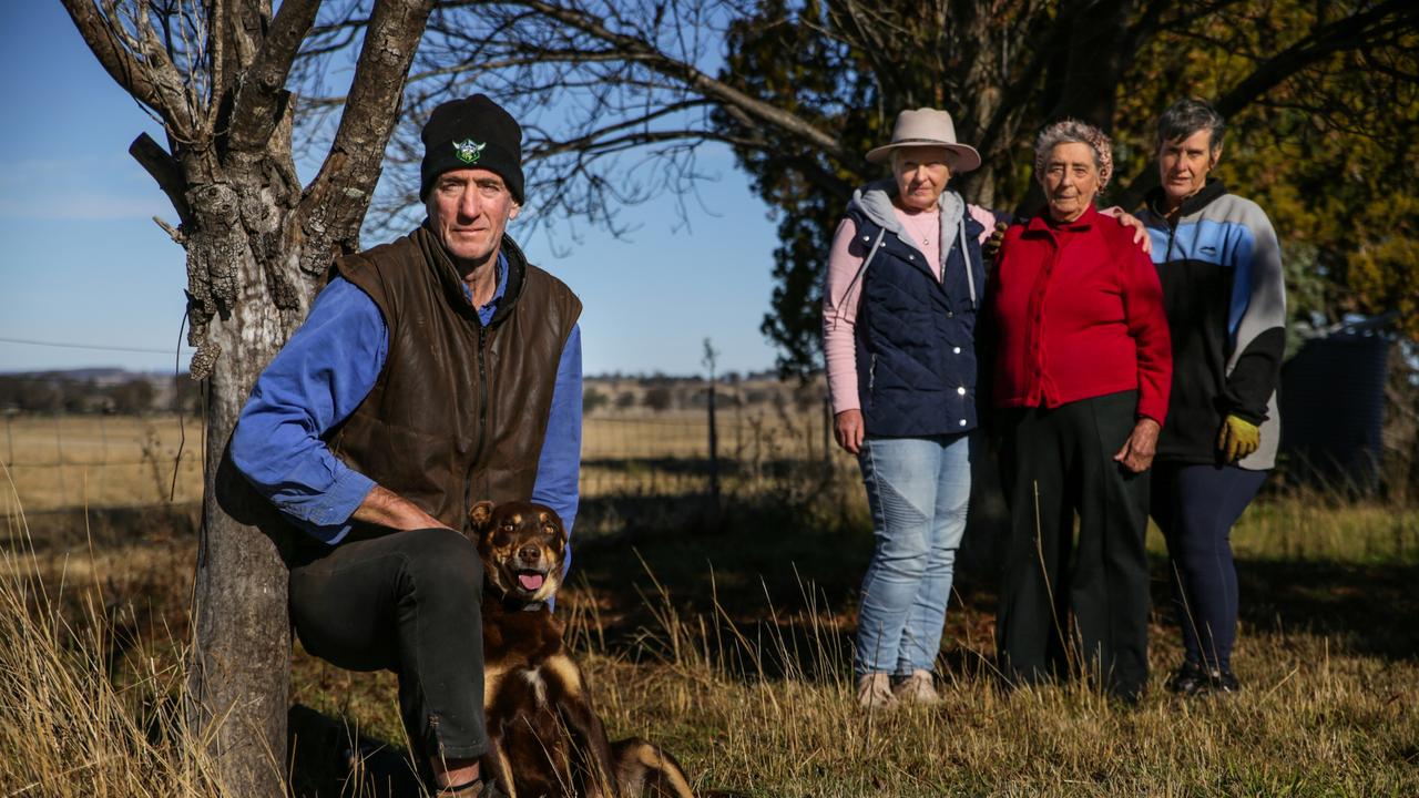 Farmers in NSW new renewable energy zones are distressed by government department EnergyCo forced acquisition of their land to install transmission lines. The Jones farming family near Dunedoo on their property. (L to R) Anthony, dog- Blue, (wife) Anne, and (mother) Rita Jones, plus (sister) Deb Robinson. Picture: Dean Marzolla