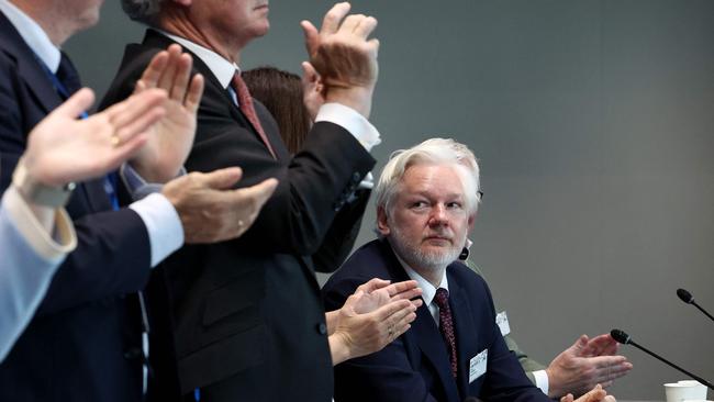 Mr Assange is applauded after a parliamentary hearing at the Council of Europe in Strasbourg. Picture: AFP