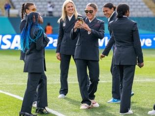 AUCKLAND, NEW ZEALAND - JULY 22: Trinity Rodman #20 talks a photo of Crystal Dunn #19 of the United States  before a FIFA World Cup Group Stage game between Vietnam and USWNT at Eden Park  on July 22, 2023 in Auckland, New Zealand. (Photo by Brad Smith/USSF/Getty Images for USSF).