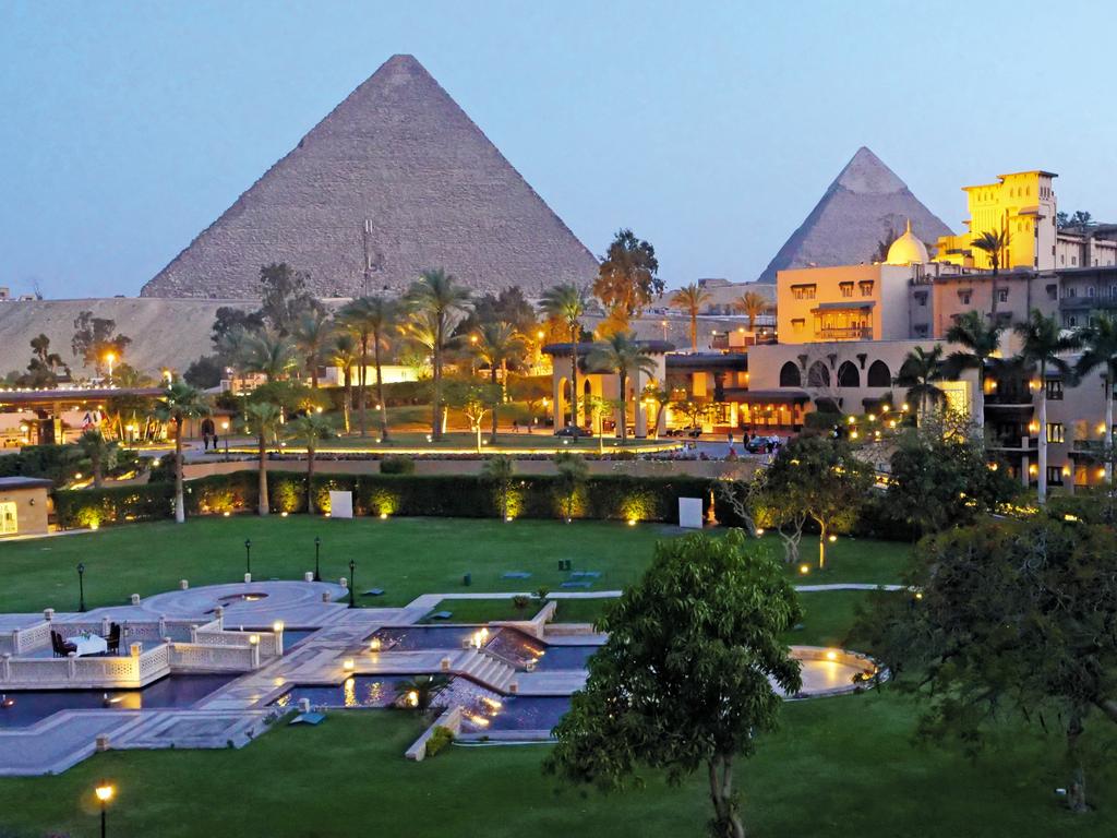 Al Ahram has pyramids as a backdrop in Giza.