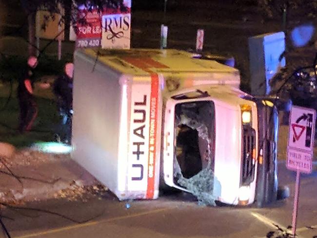 The suspect’s U-Haul rental truck flipped onto its side with police in hot pursuit. Picture: AFP/Michael Mukai