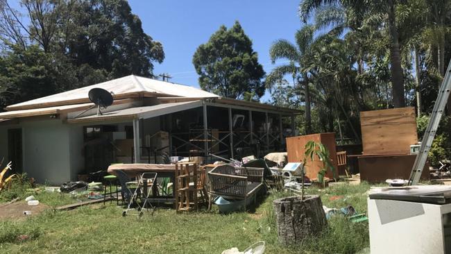 The couple’s furniture and boxes have been left sitting on the yard and veranda because the home and garage are just too filthy. Picture: Crystal Jones