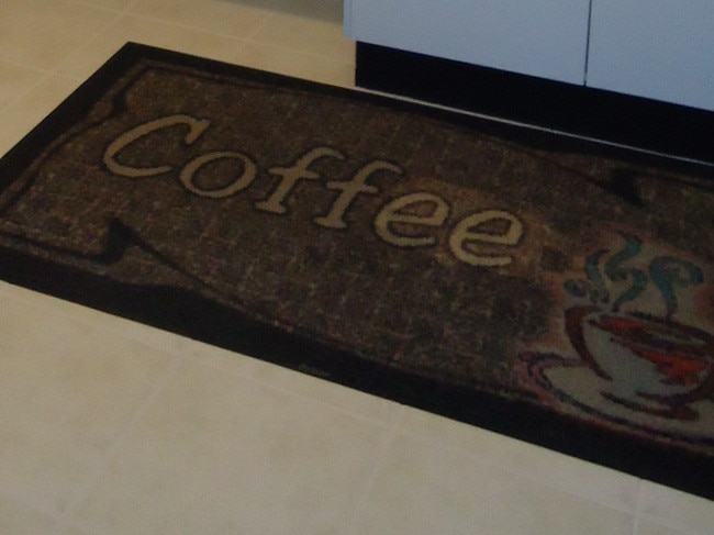 The Gosford site’s original owners provided investigators a picture of the coffee floor mat in the kitchen of the property before it was demolished. Picture: supplied