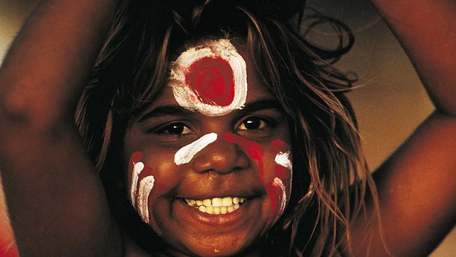 A Portrait of Australia: The best stories from 30 years of Australian Geographic. The people of the Tanami The face of Carol Green Napangardi painted in the colours of her local footy team at Lajamanu on the Tanami Road. Photo by Bill Bachman