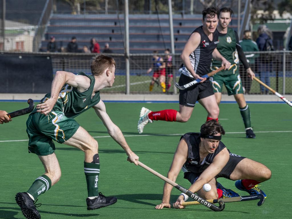 Trent Goldenstein, Ipswich and Jonathan Allcock, Mackay. 15 Ipswich vs Mackay. Hockey Queensland Championship. Saturday, May 1, 2021. Picture: Nev Madsen.