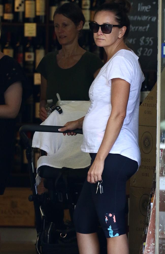 Michelle waits at a local store with Axel. Picture: Matrix/GC Images