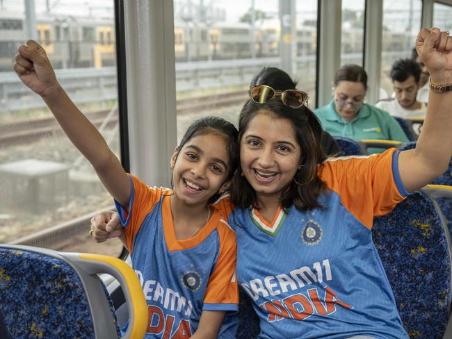 Niraj Gaherwar and Meenakshi Wani Karki pictured cheering on the train. Picture: Monique Harmer