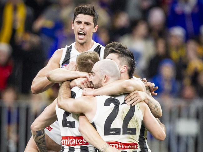 Scott Pendlebury leads Collingwood’s celebrations. Picture: AAP