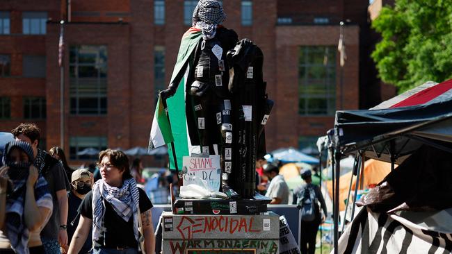 A statue of George Washington is draped in a Palestinian flag and wrapped in a keffiyeh in University Yard at George Washington University. Picture: Getty Images via AFP.