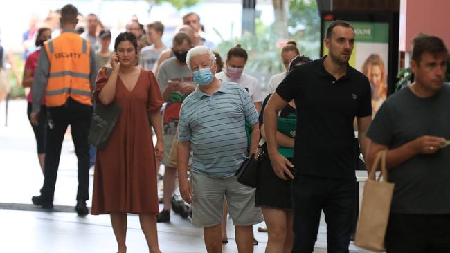 Hundreds of people line up to get into Woolworths at Gasworks Plaza in Newstead after it was announced Greater Brisbane will go into lockdown for three days from 6pm. Picture: Adam Head