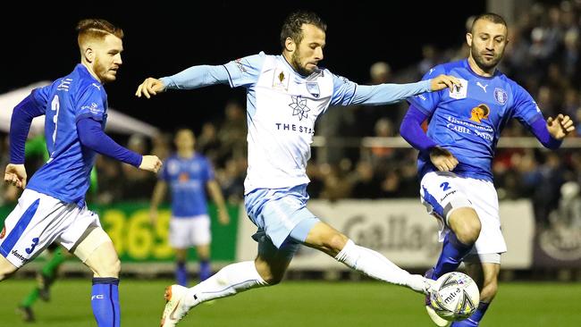 Sydney FC striker Adam Le Fondre gets in between two Avondale FC defenders