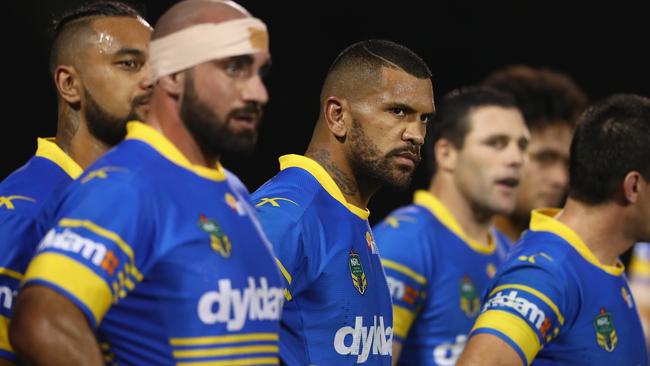 The Eels look on dejected after a Panthers try.