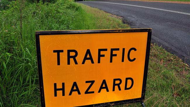 Land slip in Duke Road Doonan poses a hazard to motorists.Traffic Hazard signPhoto Geoff Potter / Noosa News.