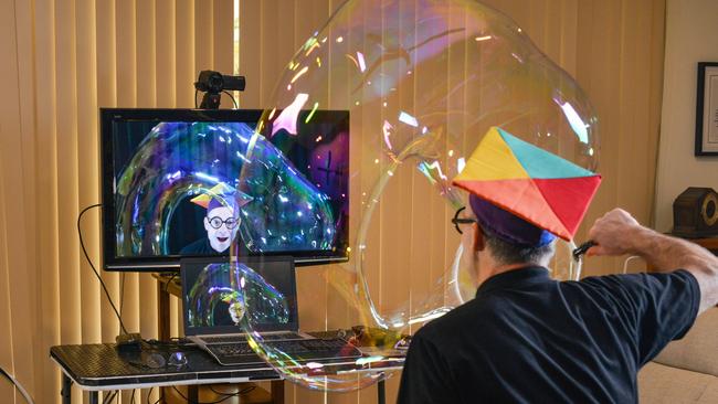 Graeme Denton (aka Marty McBubble) in his makeshift home studio performing The Scientific Bubble Show for an online audience. Picture: AAP/Brenton Edwards