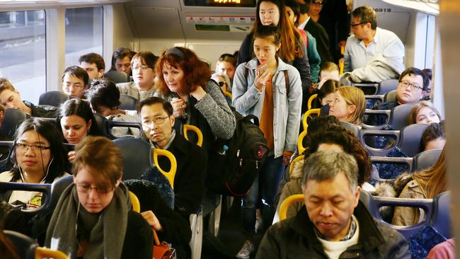 Should Sydney’s trains go from having lots of seats like this ... Picture: Peter Clark