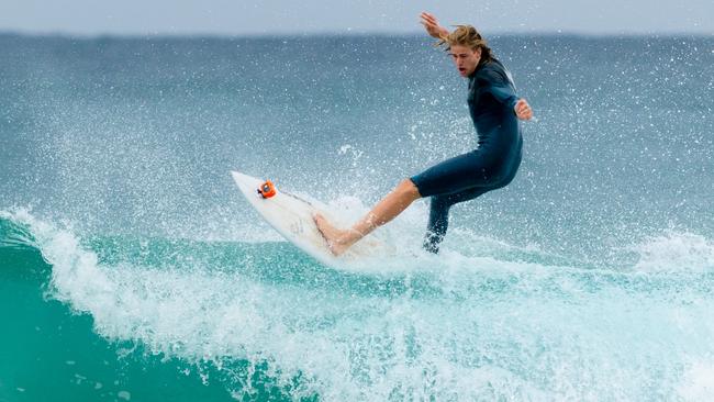 Young ruckman Callum Jamieson (West Coast) carved up waves with local surfing legend Mick Fanning at Tugun. Photo: Destination Gold Coast