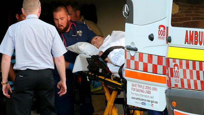 Ambulance officers treat Dr Angela Jay after the brutal attack. Picture: Nathan Edwards