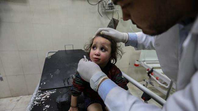 A little girl is treated at hospital after an Israeli air strike bombed her home. Picture: Getty Images