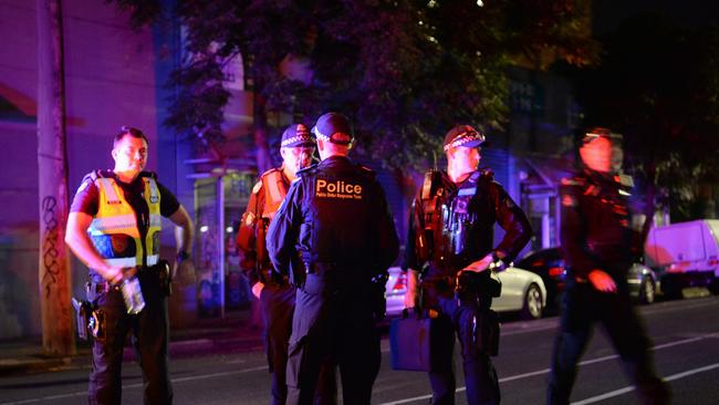 Police at the scene where there people were shot and one killed. Picture: Lawrence Pinder