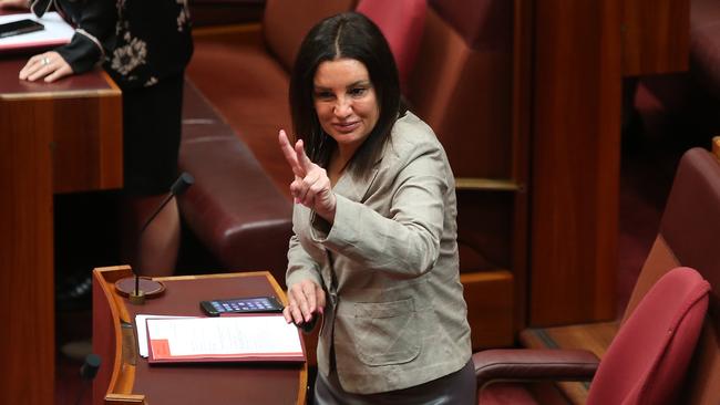 Jacqui Lambie, during the swearing-in of new senators yesterday, is sweating on advice from the British Home Office. Picture: Kym Smith