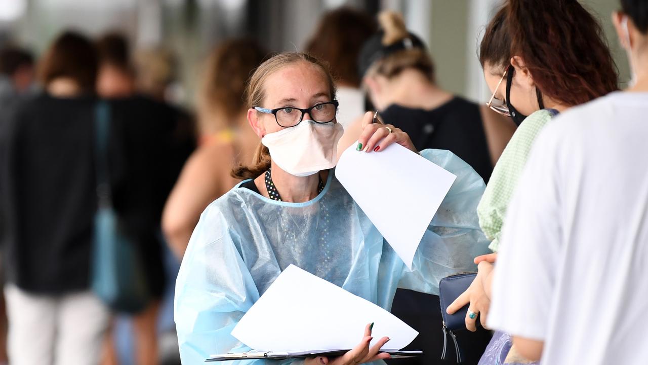 People line up for a Covid test outside a clinic near the Mater Hospital. Cases in Queensland are still on the rise following the state reaching a first-dose vaccination rate of 90 per cent. Picture: NCA NewsWire/Dan Peled