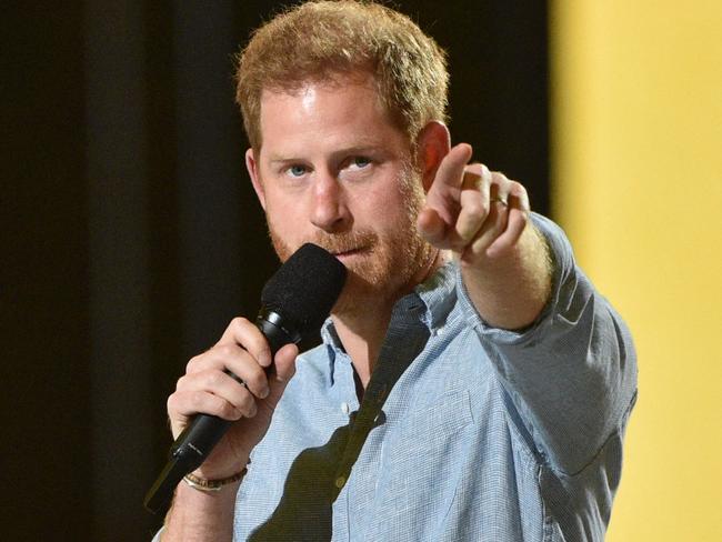 Prince Harry, Duke of Sussex, gestures as he speaks.